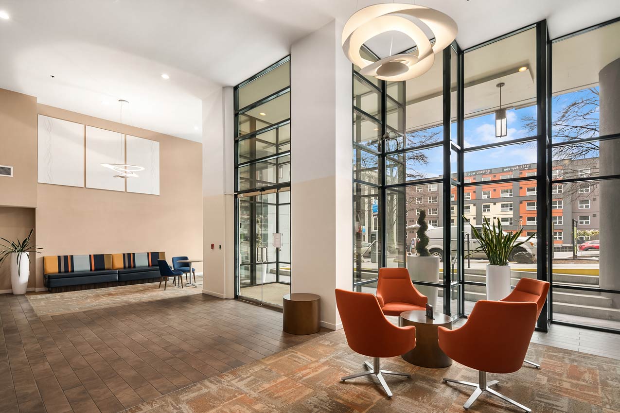 Common area with large windows and lounge seating