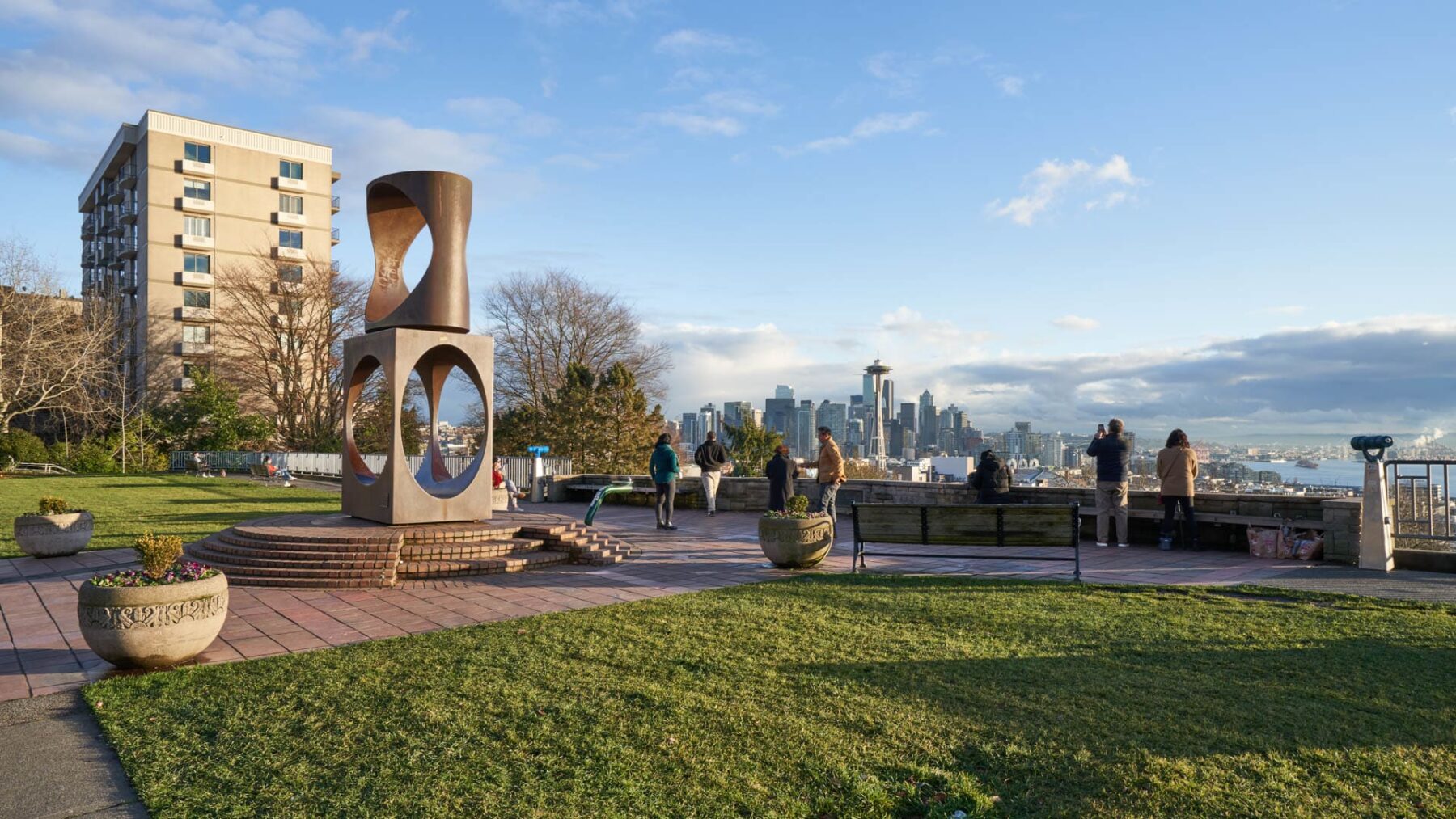 View of green Kerry Park which has a modern sculpture and stunning skyline view